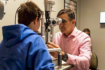 Child receiving optometry exam